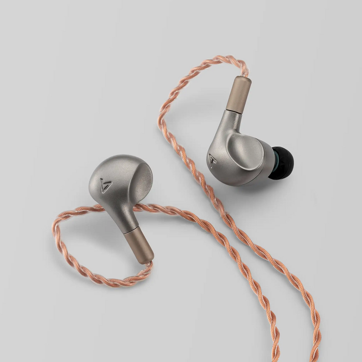 Astell&amp;Kern LUNA IEMs sitting diagonally on grey backdrop with Eletech cable attached 