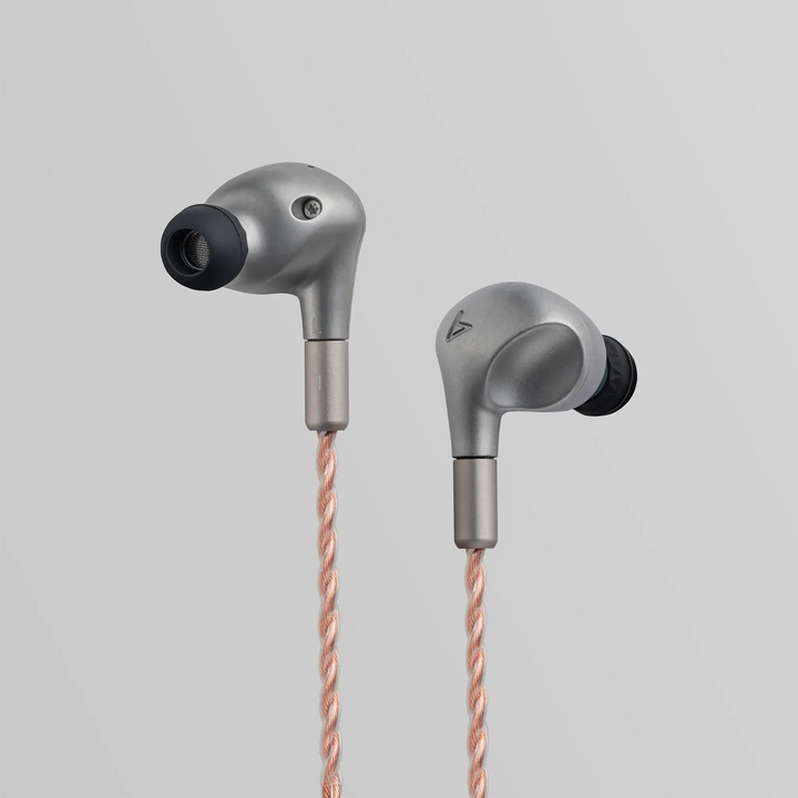 Astell&amp;Kern LUNA IEMs floating front and back view closeup with cable hanging down grey backdrop