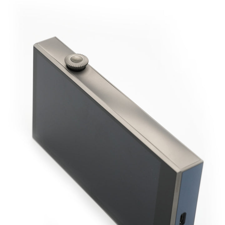 Astell&amp;Kern SE300 Titan 3 quarter front edge highlighting volume knob over white background