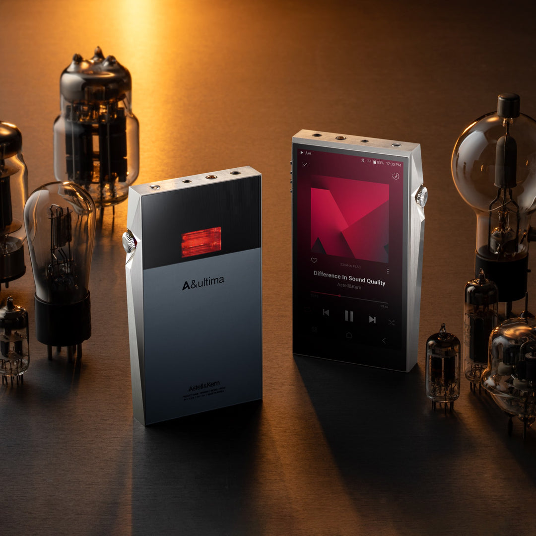 x2 Astell&amp;Kern SP3000T units top quarter over warm background with assorted tubes