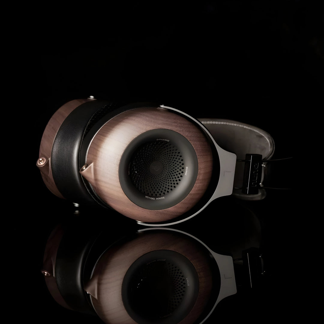 DUNU Mortise headphones lying on side left ear cup view black background