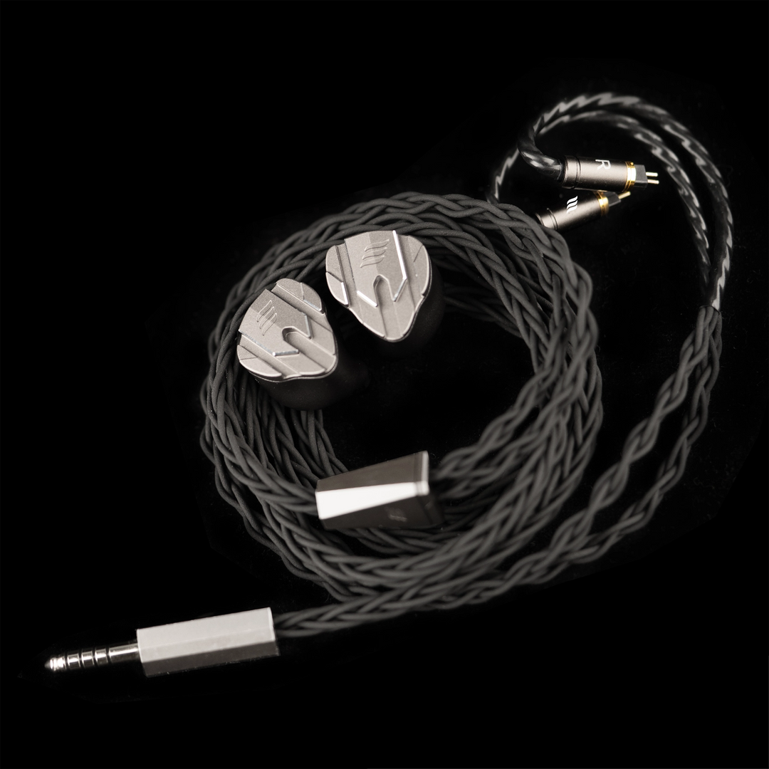 effect audio perseus coiled audio cable with silver connectors on a black background