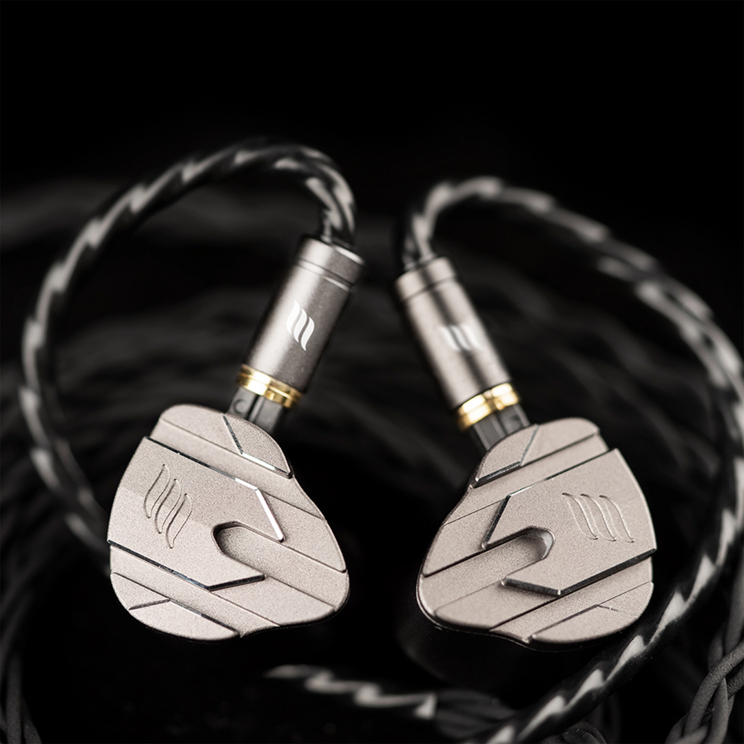 Pair of effect audio perseus iems with metallic finish on a dark background