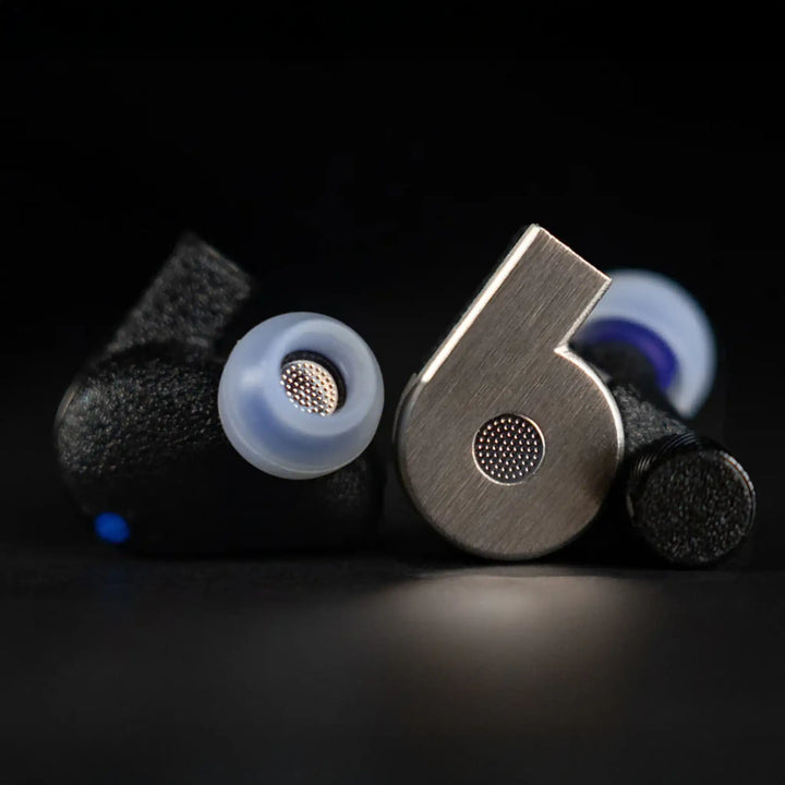 FATfreq x Effect Audio Quantum iems front and back view closeup with ear tips on sitting on black background