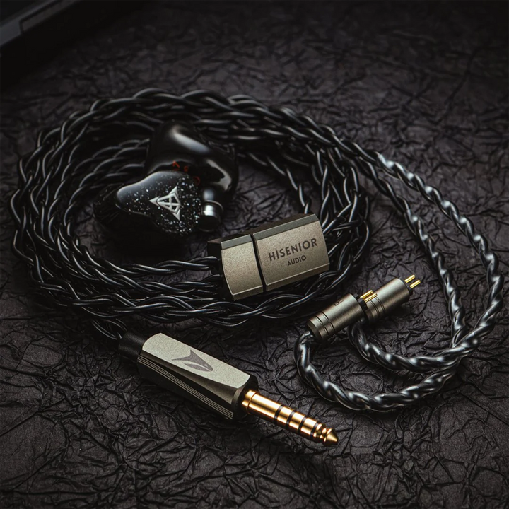 Hisenior Mega7 iems with orca cable sitting on black background