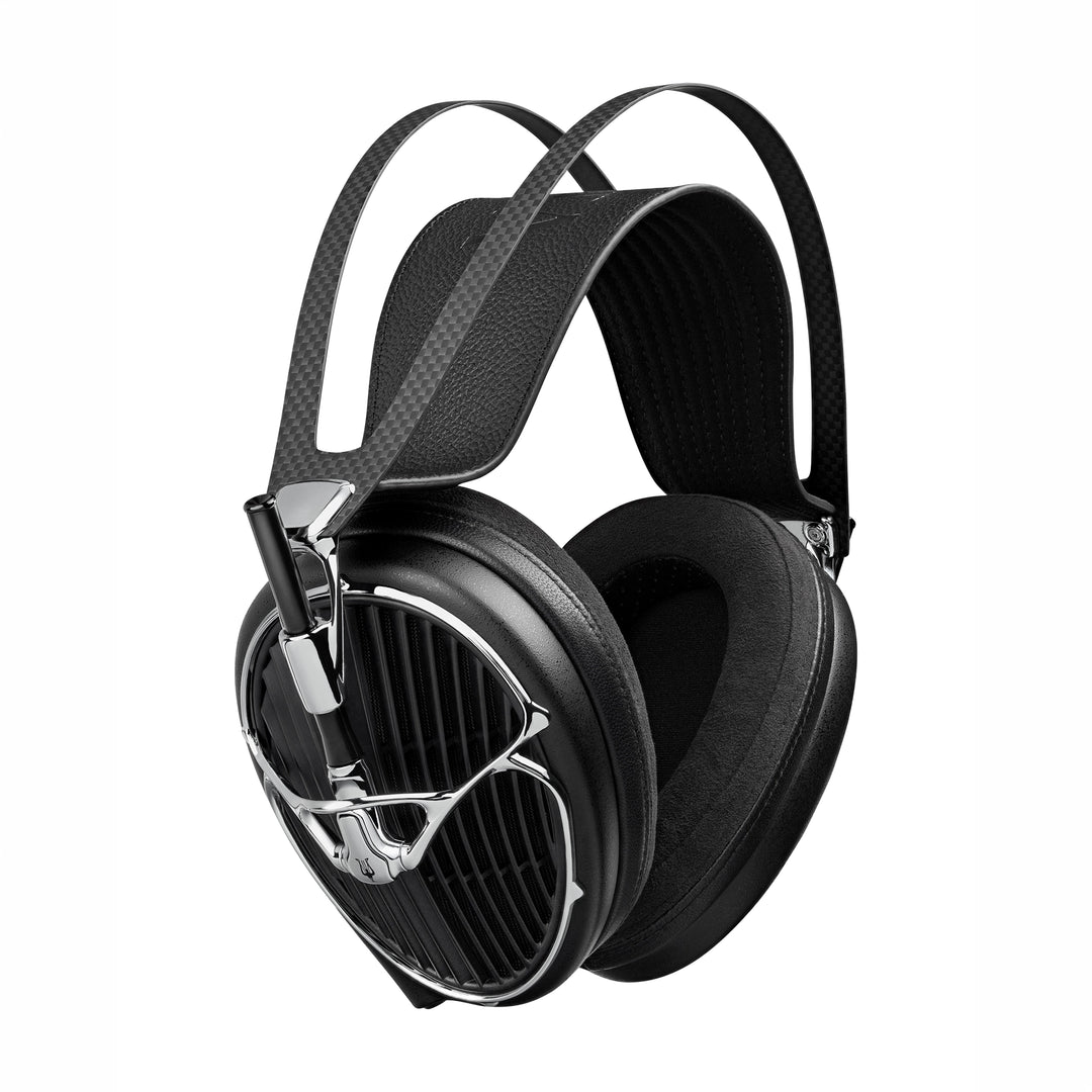 Meze Audio Arta headphones with a textured carbon-fiber-patterned headband strap and polished silver metal accents, shown on a solid white background.