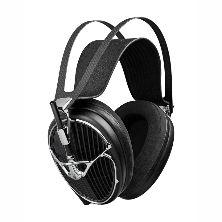 Meze Audio Arta headphones with a textured carbon-fiber-patterned headband strap and polished silver metal accents, shown on a solid white background.