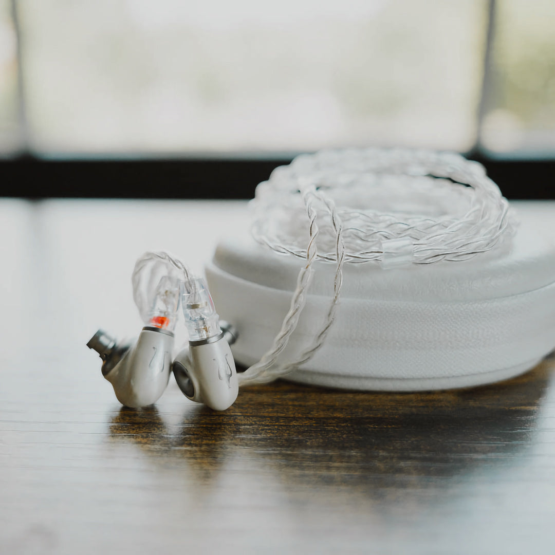 Meze Audio Alba with attached stock coiled cable on stock case