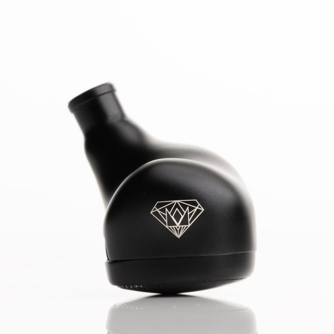Noble Audio Onyx extreme closeup rear right earphone over white background