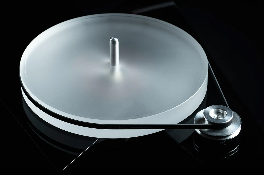 Pro-Ject AC/DC turntable center top down angle of sub platter on black backdrop