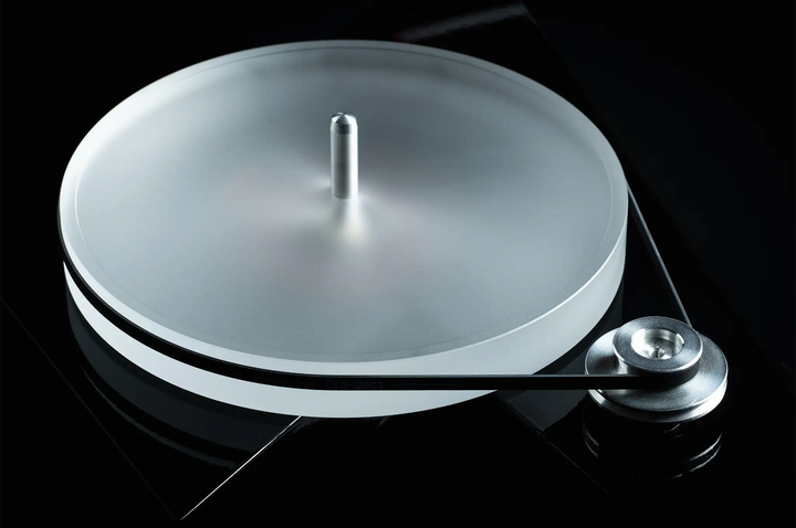 Pro-Ject AC/DC turntable center top down angle of sub platter on black backdrop