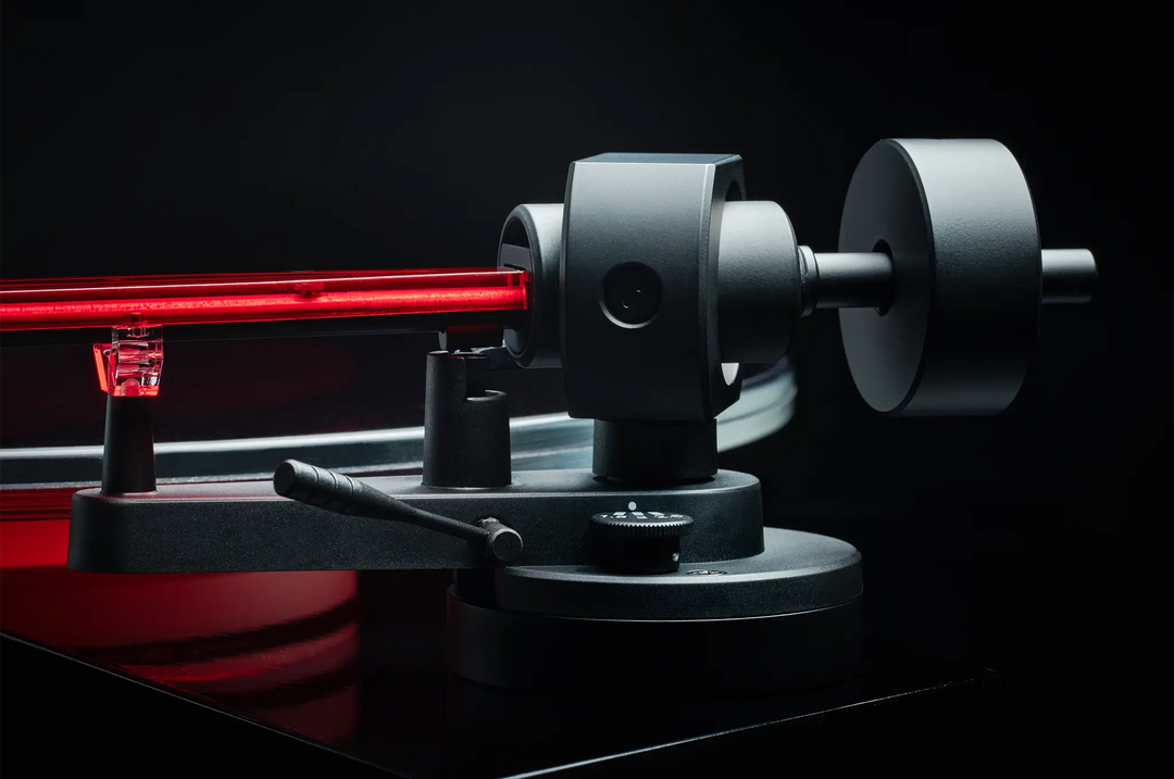 Pro-Ject AC/DC turntable closeup of tonearm gimble on black backdrop