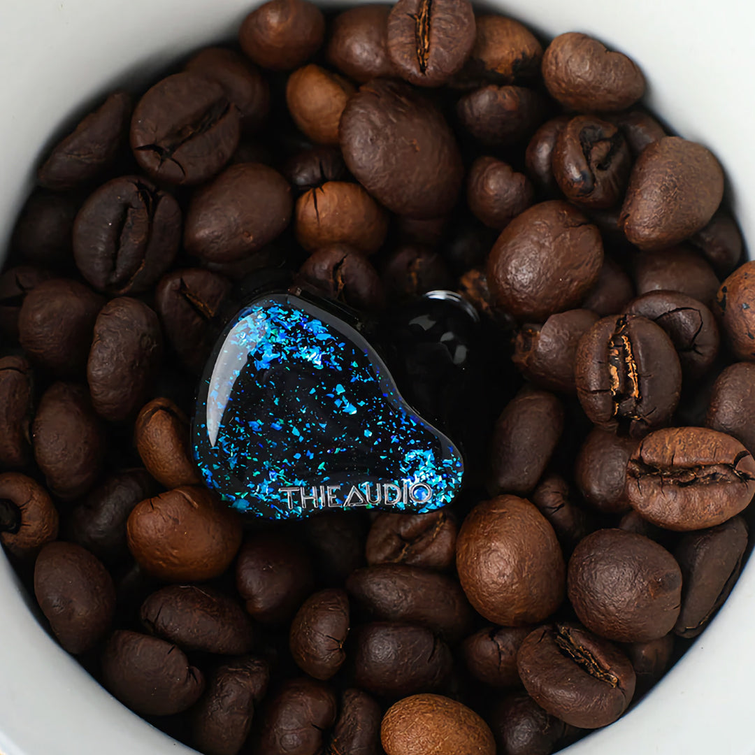 Thieaudio Hype 4 black front in cup of coffee beans
