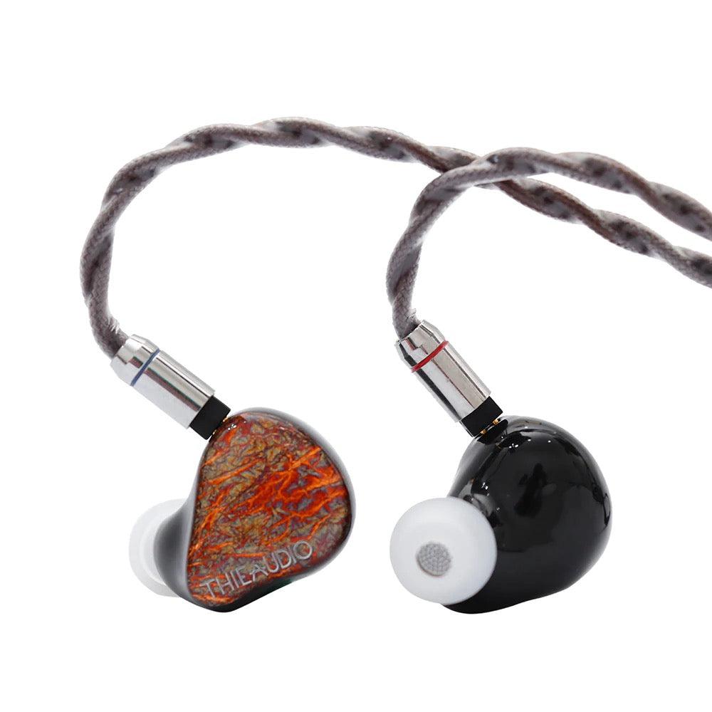 Thieaudio Monarch MKII front and back with attached cable over white background