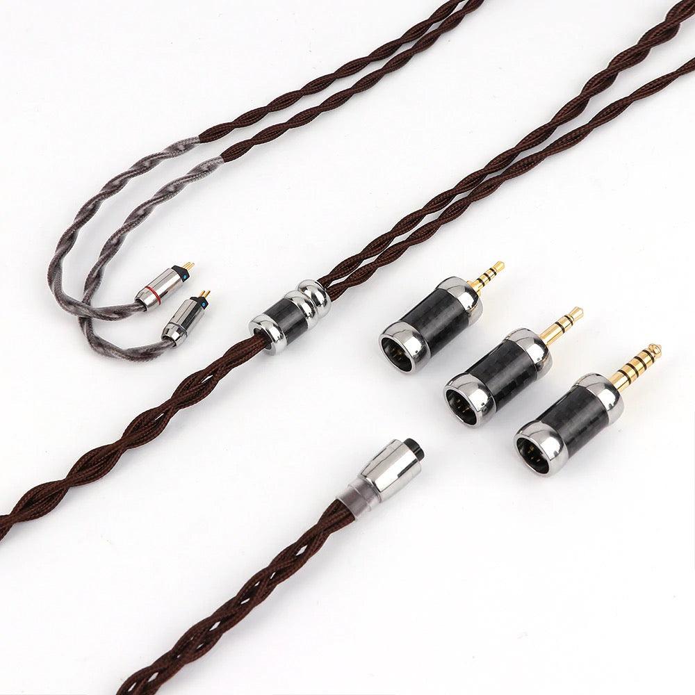 Thieaudio Monarch MKII included cable and assorted adapters over white background
