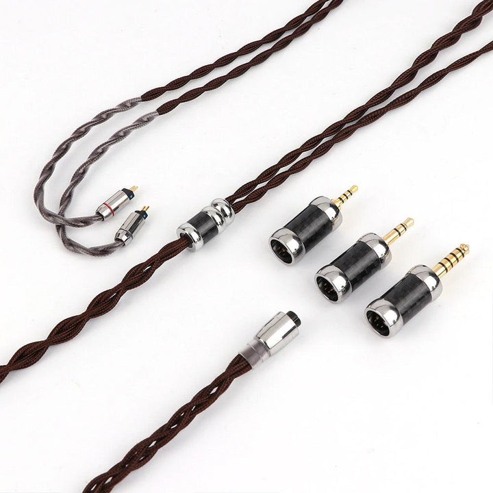 Thieaudio Monarch MKII included cable and assorted adapters over white background